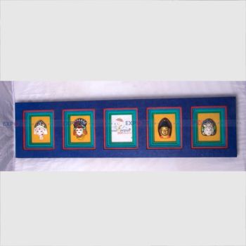 Paper wall hanging made with lokta with different ceramics god framing.