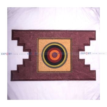 Paper wall hanging made with lokta with paper roll in the middle in aankhijhyal design.