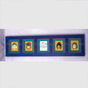 Paper wall hanging made with lokta with different ceramics god framing.